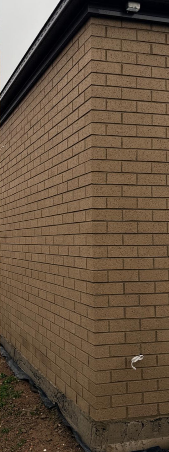Brick cleaning in Melbourne — a buff brick wall after cleaning, with an even tone and no burning